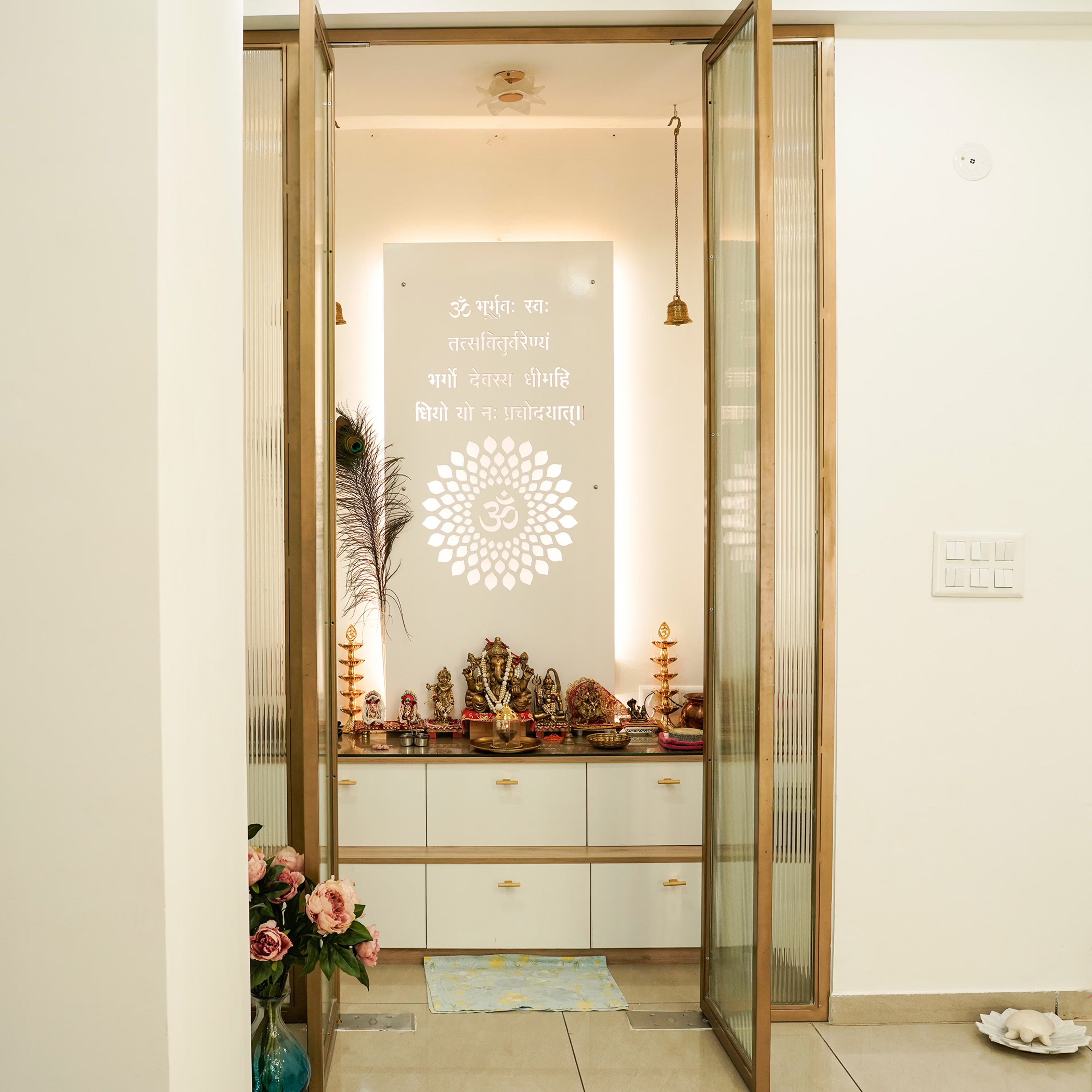 Modern Pooja Room Design with Concealed Storage and Lotus Motif